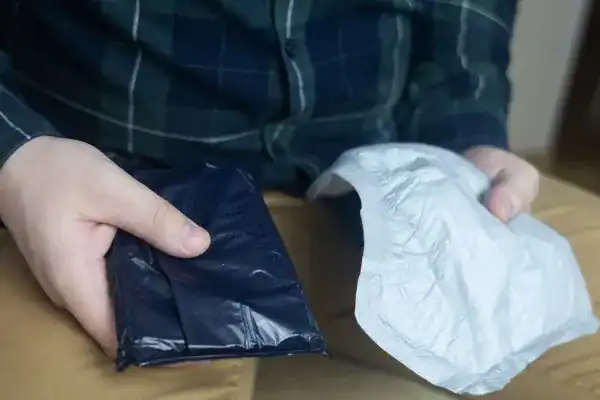 image of man holding stool incontinence Swansea products